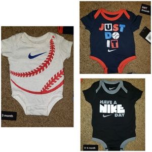 3 Baby Boy Nike Onesies. One is NWT